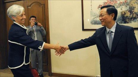 Christine Lagarde shakes hands with Chinese finance minister Xie Xuren