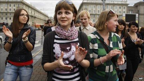 Young protesters clap as they participate in a peaceful protest against the authoritarian regime of President Alexander Lukashenko in Minsk, Belarus, on Wednesday