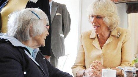 The Duchess of Cornwall talks to Mary Bennett, 101, at Llandovery railway station