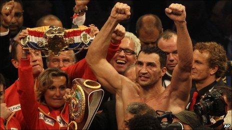 Klitschko raises his hands aloft in triumph after winning the fight