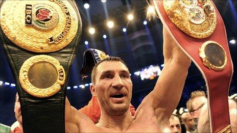 Wladimir Klitschko holds his title belts