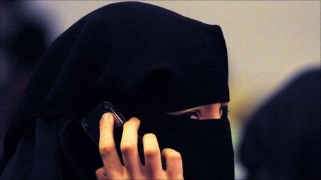 A woman wearing a burqa talks on a mobile phone in Sydney. Photo: July 2011