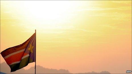 A South Sudanese flag flutters at sunset in January 2011
