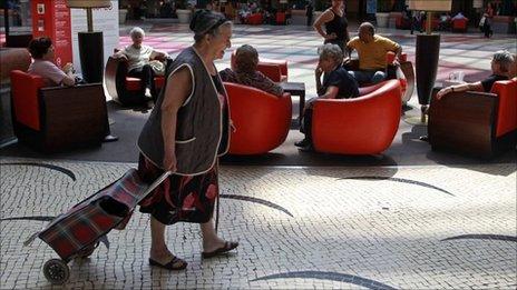 Woman with shopping trolley in Lisbon