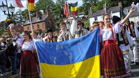 The parade of nations crossing the bridge in Llangollen