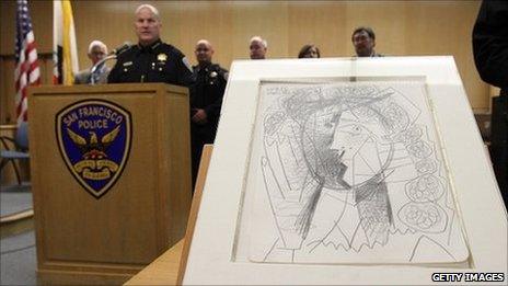 San Francisco police chief Greg Suhr speaks next to the recovered Picasso drawing.