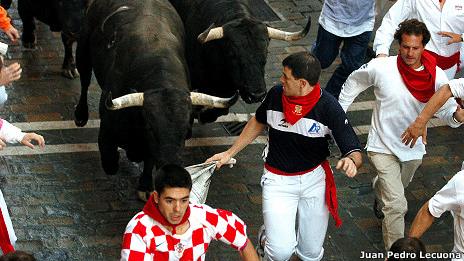 Juan Pedro Lecuona (in dark shirt) being chased by bulls in Pamplona