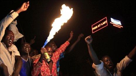 People take part in South Sudan"s independence day celebrations near the countdown clock in Juba on 9 July 2011