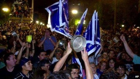 Demonstrators shout slogans during protests against the government on 20 December 2001 in Buenos Aires during a period of political and economic upheaval