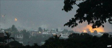 Photo taken on 4 April 2011 in Abidjan shows fire and smoke billowing from the Akouedo military camp