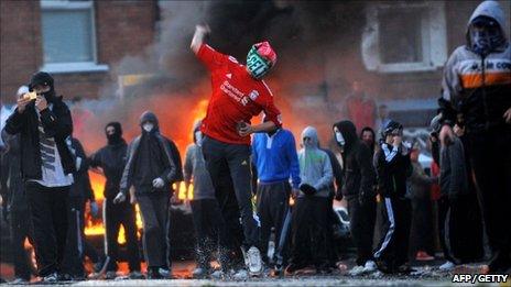 Hooded youths rioting