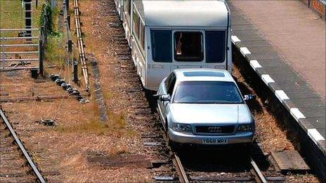 Car pulls caravan at Great Central Railway