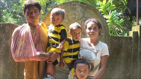 Yetriani and Mulyono with their three children