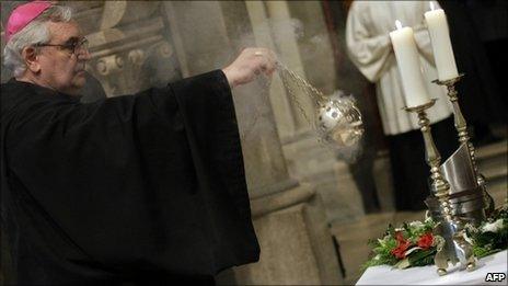 A cleric at the service before the burial of Otto von Habsburg's heart (on the table in the silver urn) in Abbey of Pannonhalma