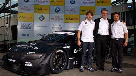 Andy Priaulx (right) alongside the 2012 BMW DTM car