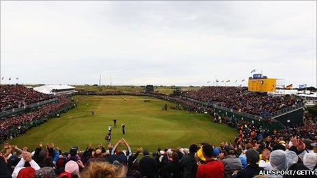 Darren Clarke of Northern Ireland celebrates victory on the 18th green during the final round of The 140th Open Championship at Royal St George's