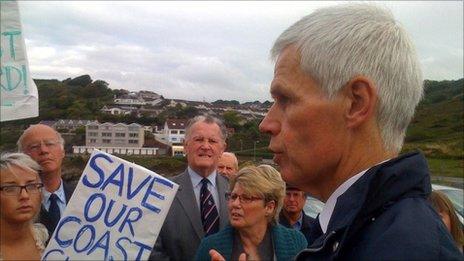 Sir Alan Massey talks to protesters in Swansea