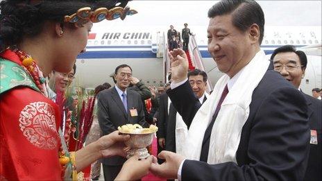 Chinese Vice President Xi Jinping, right, is welcomed upon his arrival in Lhasa, July 17, 2011