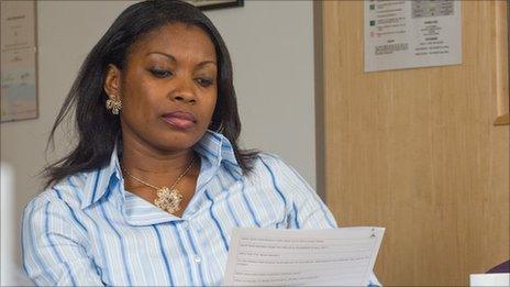 Funmi Wale-Adegbite looks through an application