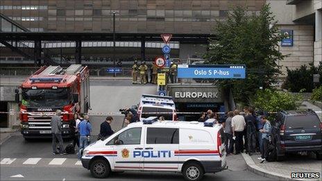 A police vehicle blocks the entrance to Oslo's central train station after a suspicious suitcase triggered a brief evacuation, 27 July.