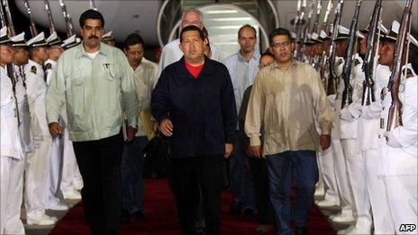 Venezuelan President Hugo Chavez (centre) arrives in Caracas from Cuba on 23 July 2011.