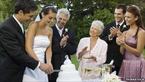 Bride and groom cutting cake
