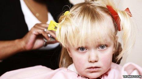 Child having her hair done