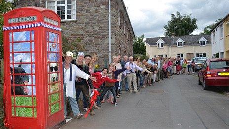 Villagers outside the phone box at Llanfrynach