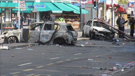 Burnt out police cars in Tottenham High Road