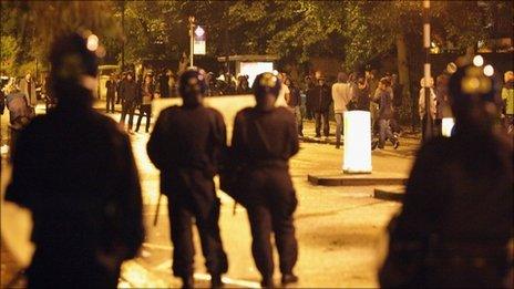 Riot police confronted by youths in Brixton