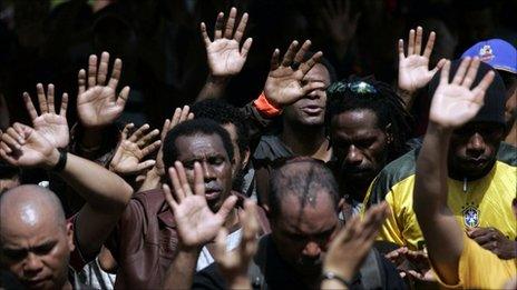 Workers from Freeport-McMoran Copper gather to pray during a week long strike in Kuala Kencana, July 11, 2011