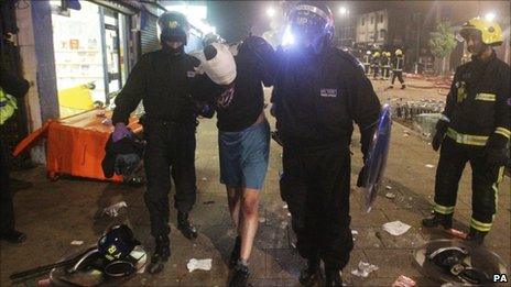 Person being arrested after rioting in Tottenham on Sunday