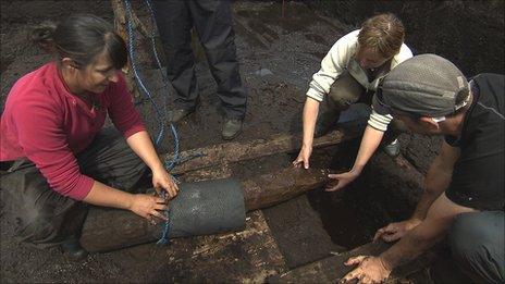 Archaeologists raising the timber road