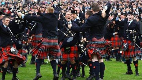 Members of Field Marshal Montgomery Pipe Band celebrate their victory