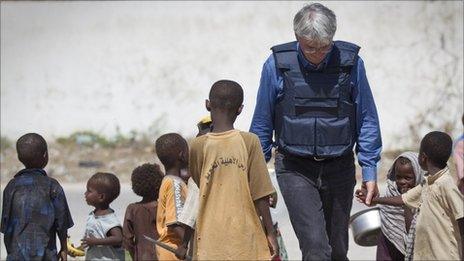 Andrew Mitchell with children at camp