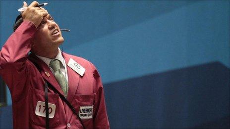 Trader works on the floor of the New York Stock Exchange, August 10, 2011