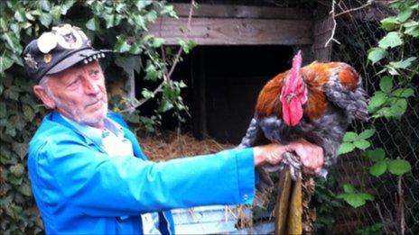 Paul Boon with one of his cockerels