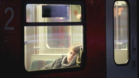 Man sleeps on train