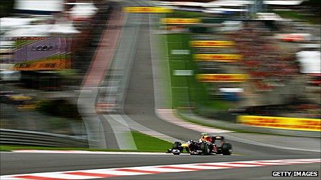 Mark Webber drives through Eau Rouge at the Belgian Grand Prix