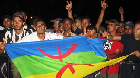 People holding the Berber flag during the annual Timitar festival in southern Morocco earlier this year (Photo taken by Richard Duebel)