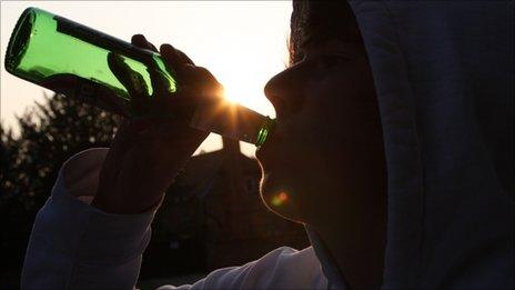 Young man drinking from bottle