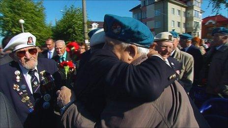 British and Russian veterans hug at the 70th anniversary of the arctic convoy mission