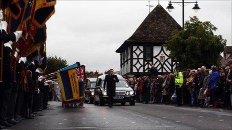 The coffin of Lieutenant Daniel Clack is driven through Wootton Bassett, Wiltshire, following his Repatriation.