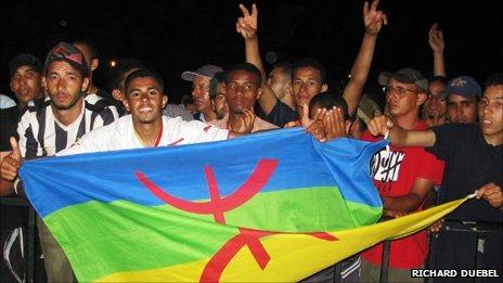 People holding the Berber flag during the annual Timitar festival in southern Morocco earlier this year (Photo taken by Richard Duebel)