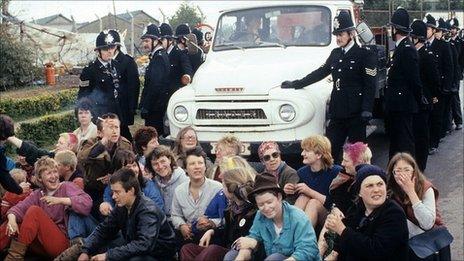 Women blocking a police van at Greenham Common in 1983