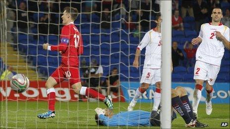 Captain Aaron Ramsey peels away after doubling Wales' lead against Montenegro