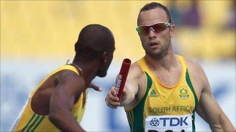 Oscar Pistorius passes the baton to Ofentse Mogawane