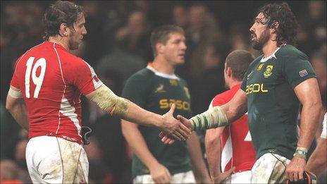 Wales forward Ryan Jones shakes hands with South Africa lock Victor Matfield