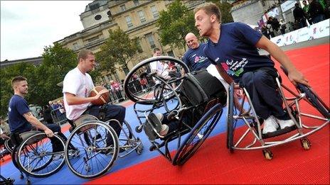 Athletes playing wheelchair basketball