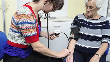 Patient having blood pressure measured